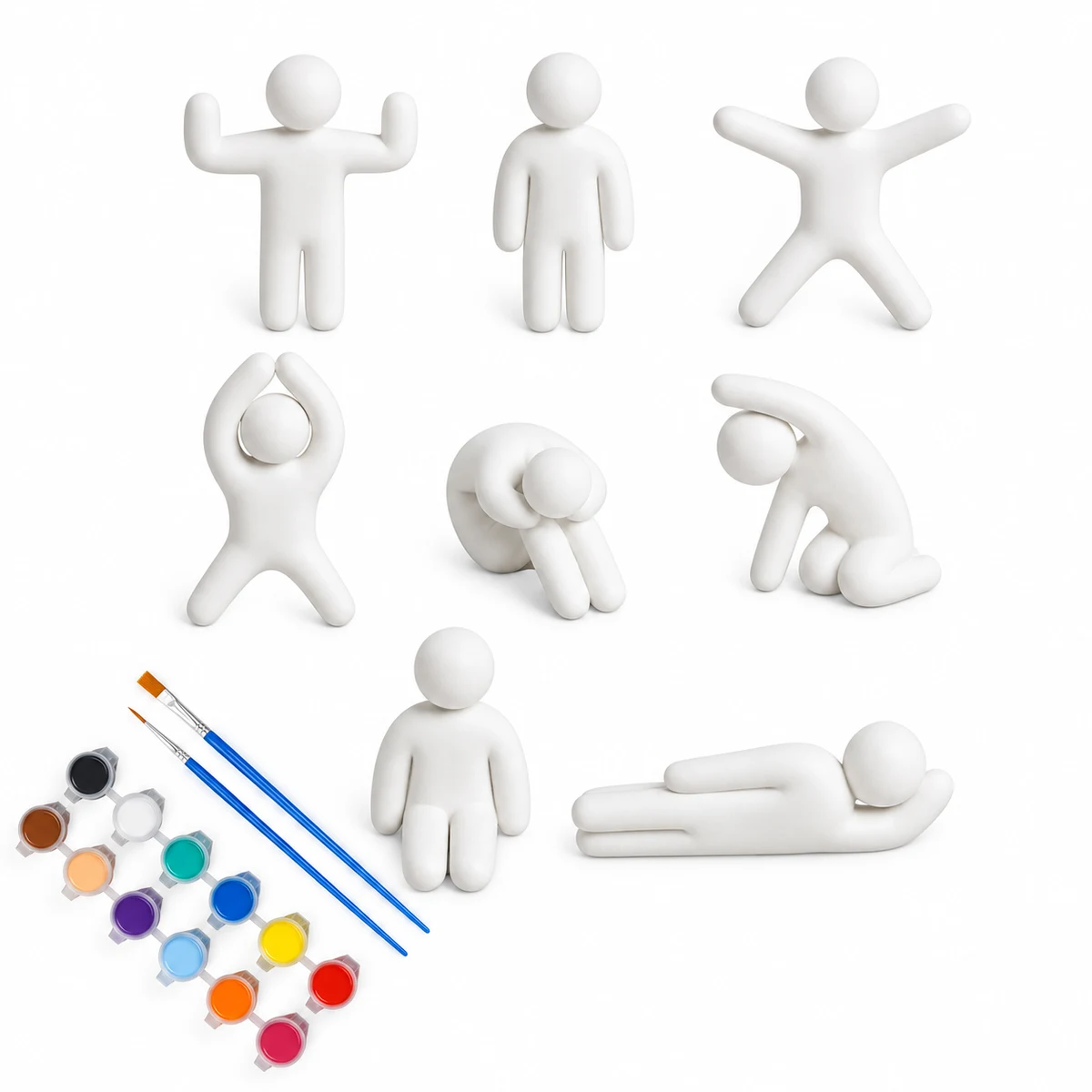 White miniature figures in eight poses arranged beside coloured paints and brushes on a white background.