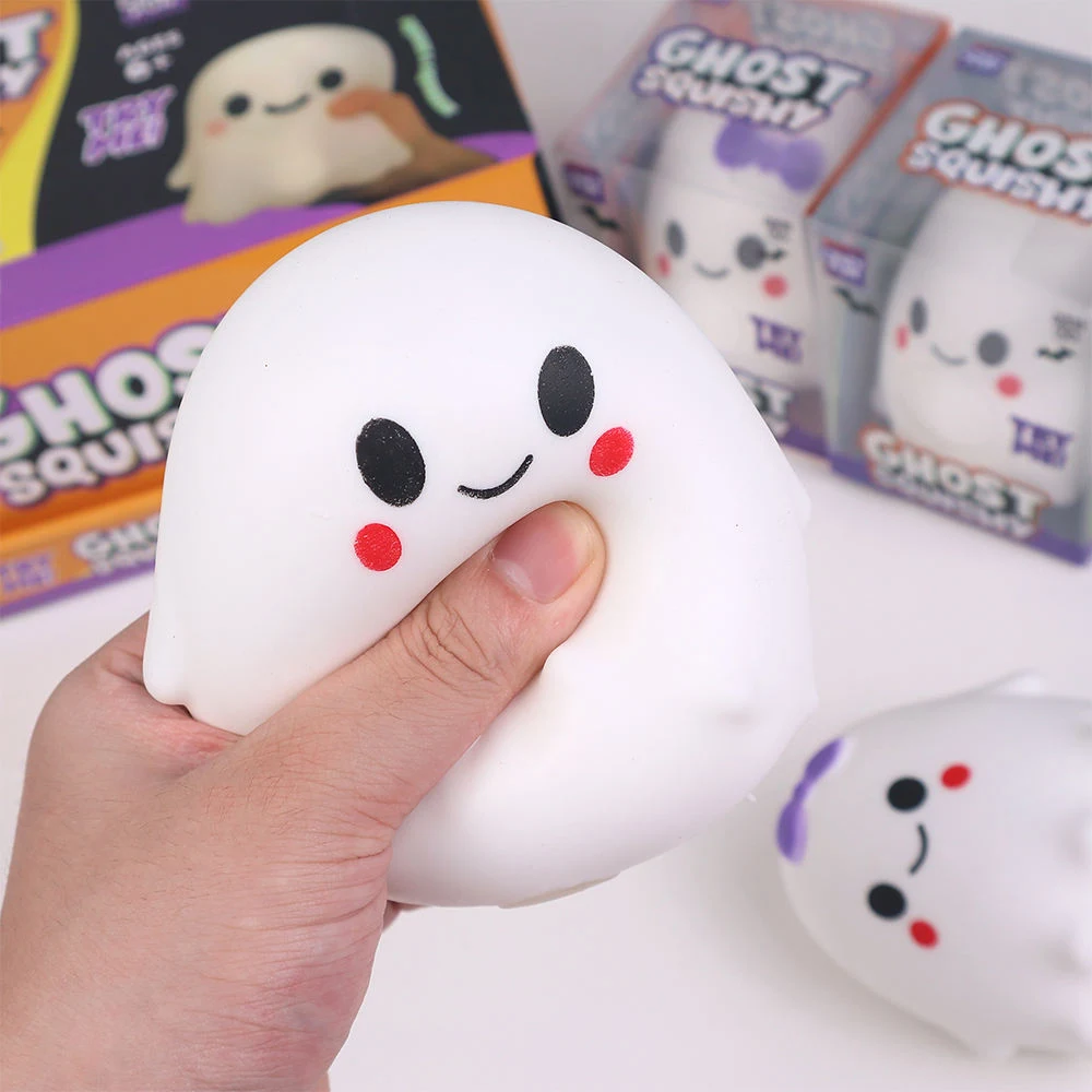 A ghost squishy toy being squeezed by hand.